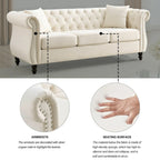 Canapé 3 places Chesterfield en velours beige, accoudoirs arrondis, garniture cloutée, structure en bois