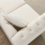 Canapé 3 places Chesterfield en velours beige, accoudoirs arrondis, garniture cloutée, structure en bois